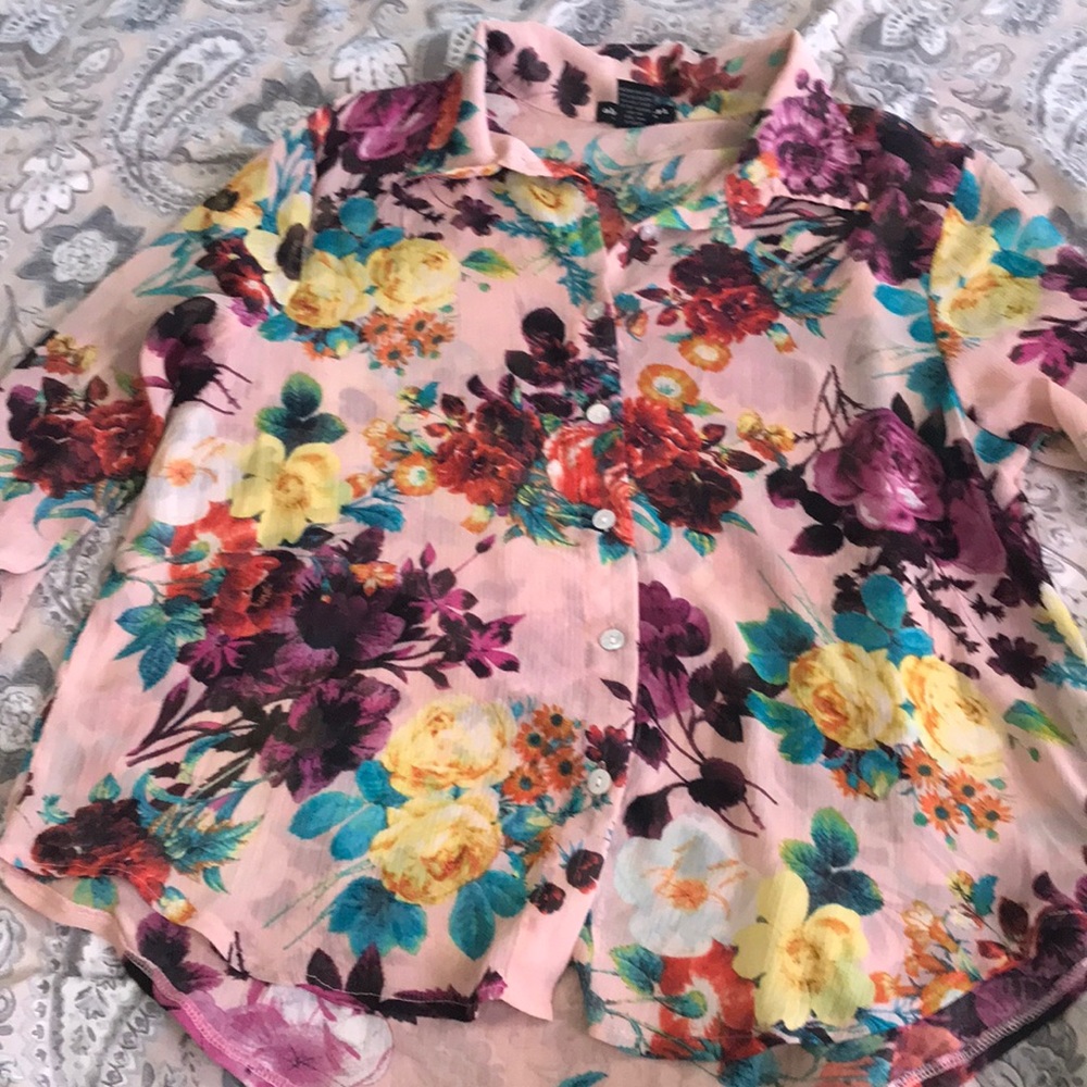 About a girl floral blouse. With pearl finish buttons
